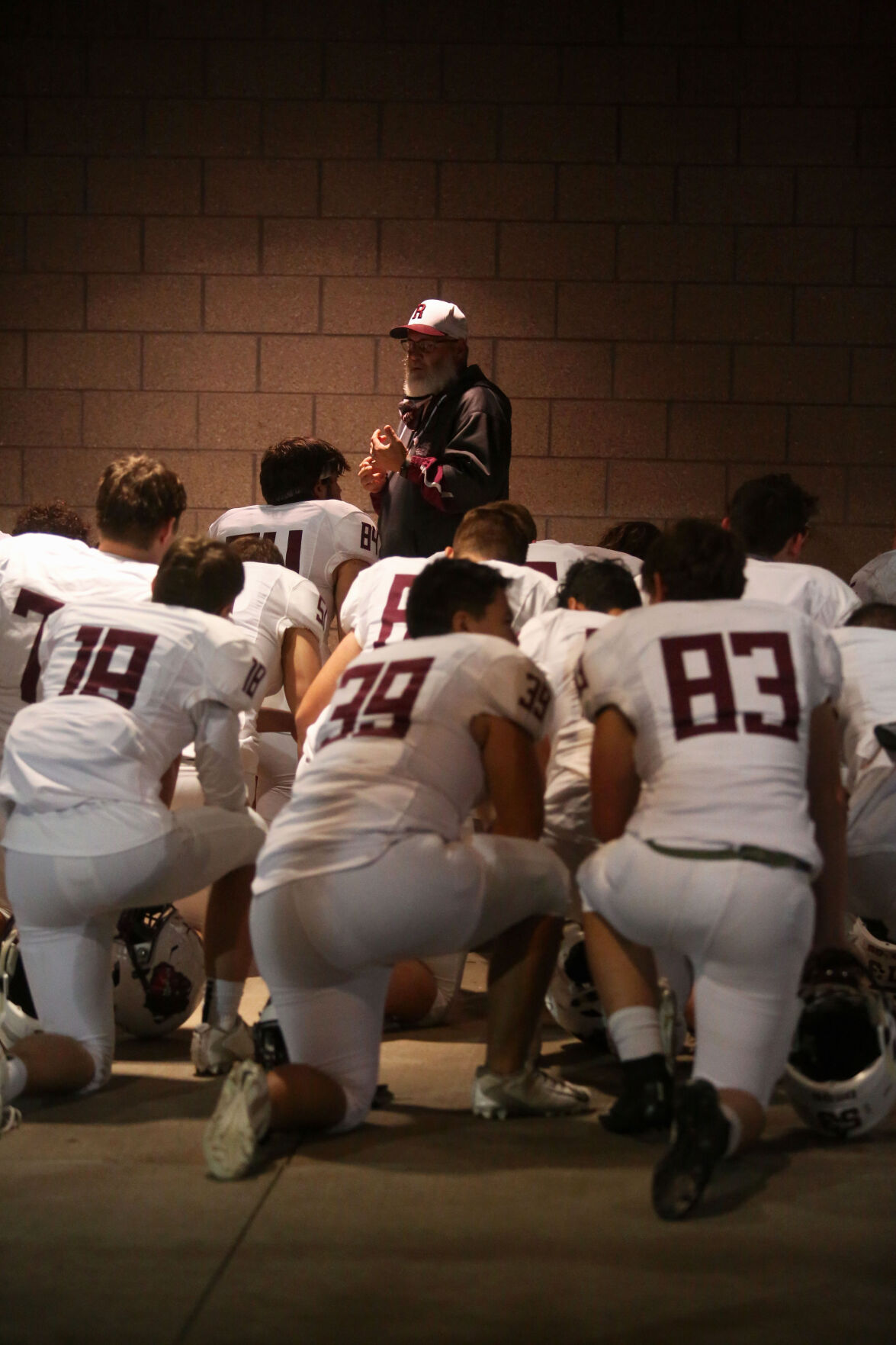 Rolla Bulldogs coach Brian Owens gives a pep talk to his players